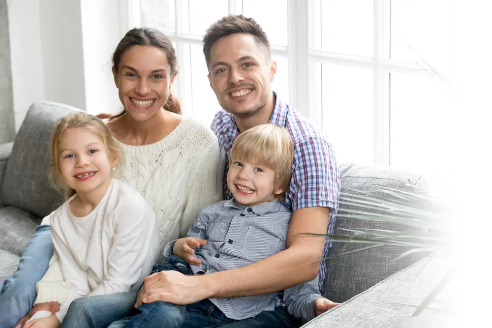 Family relaxing together in their living room