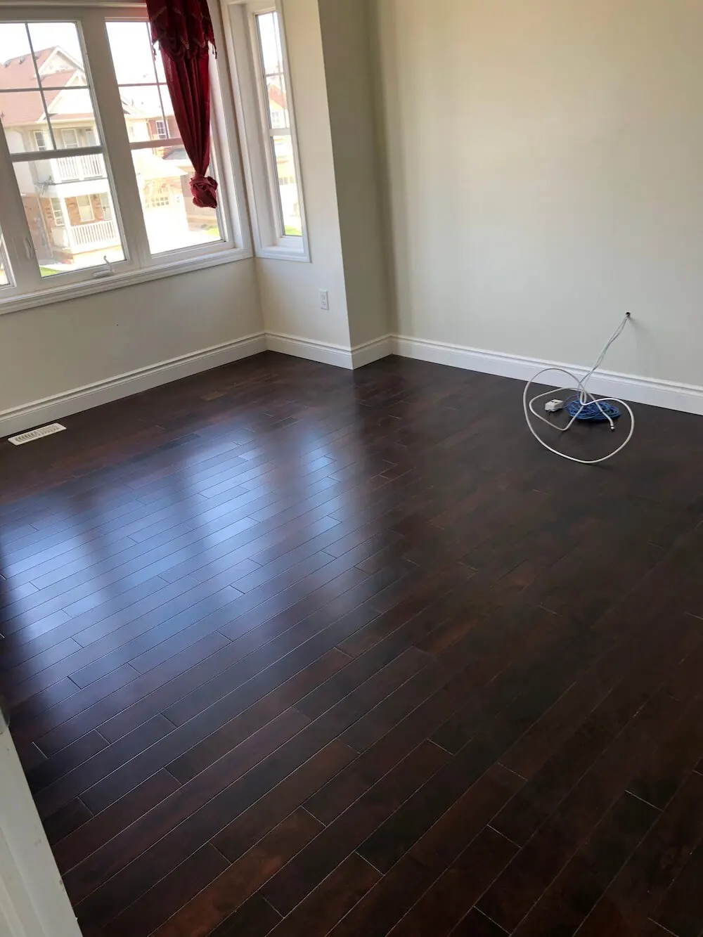 The same room with new dark hardwood flooring installed