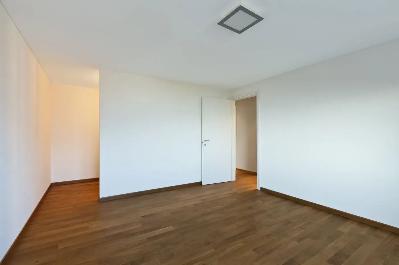 Newly laid hardwood in an empty room