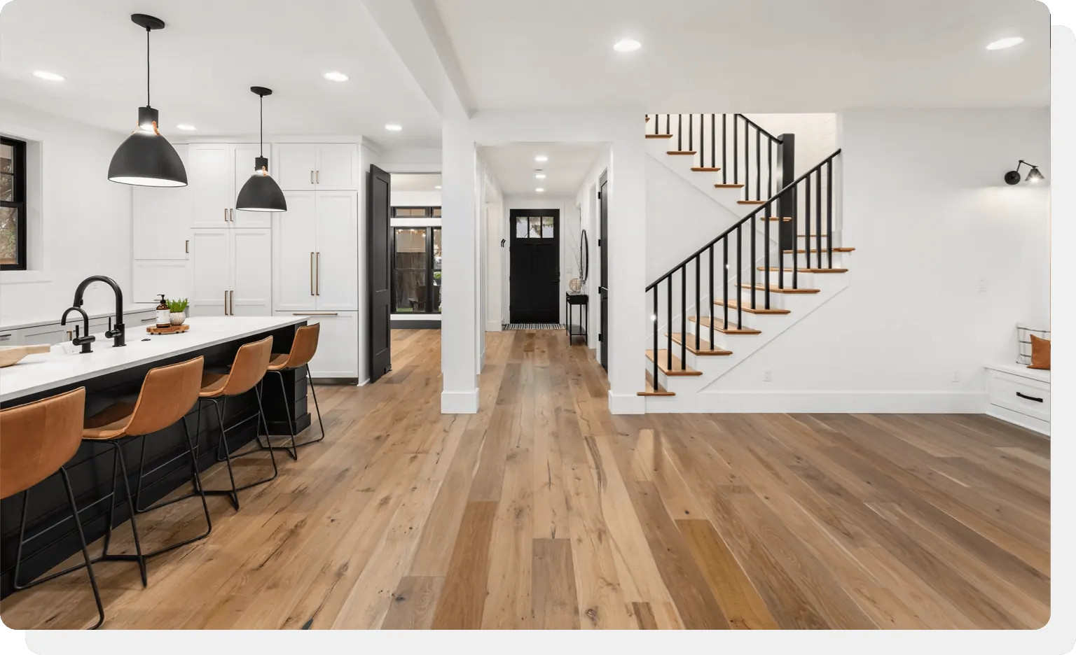 Hardwood floor and matching staircase in an open-plan home