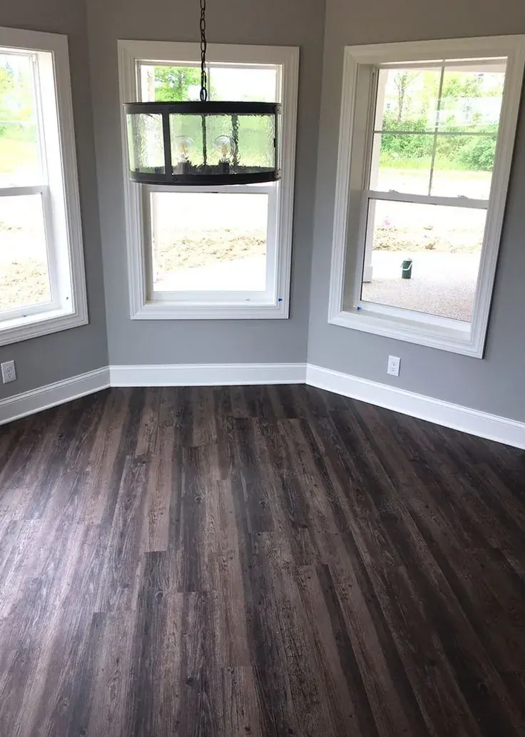 Dark laminate floor in a bright room