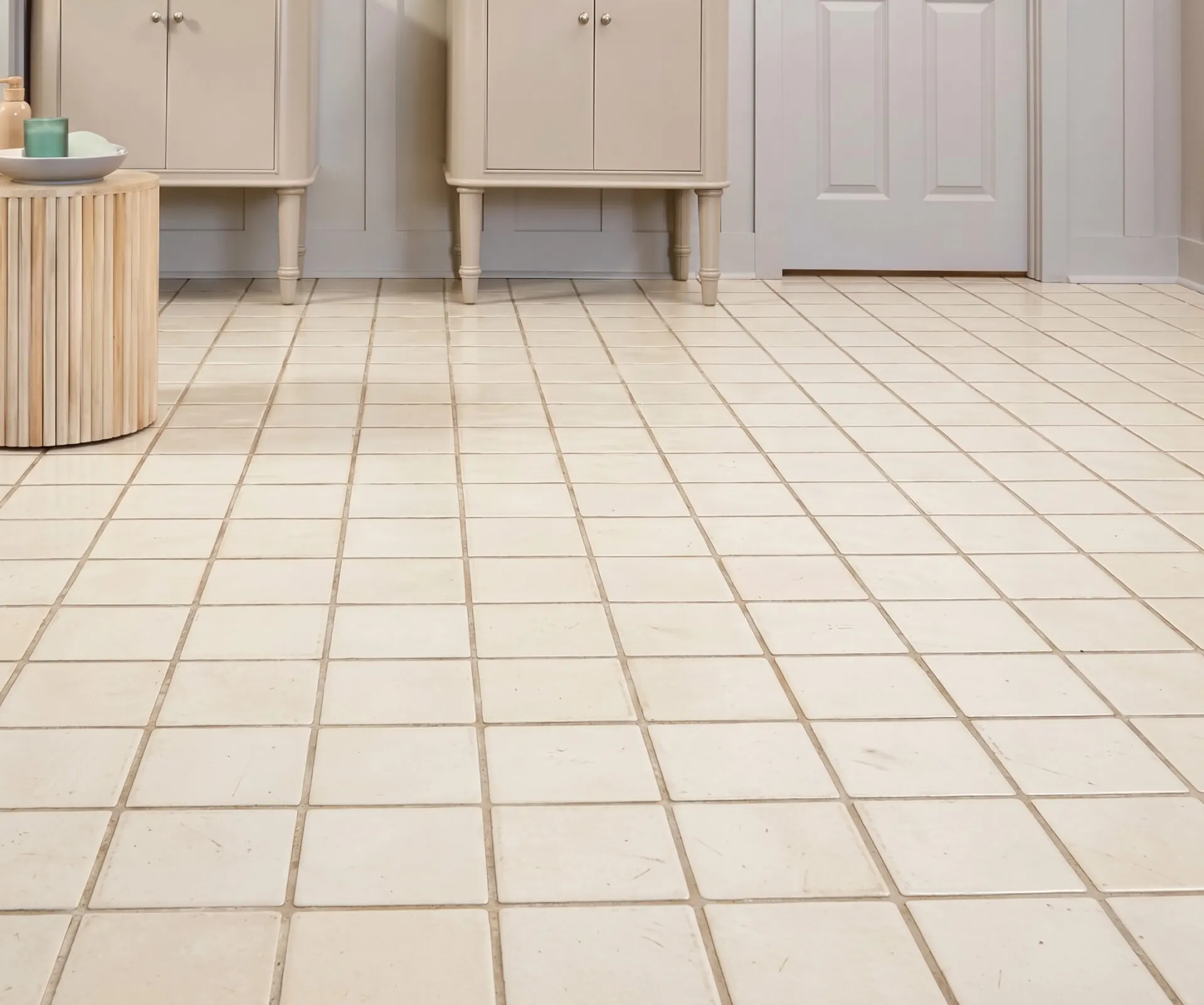 Dated cream ceramic tile in that bathroom before the vinyl