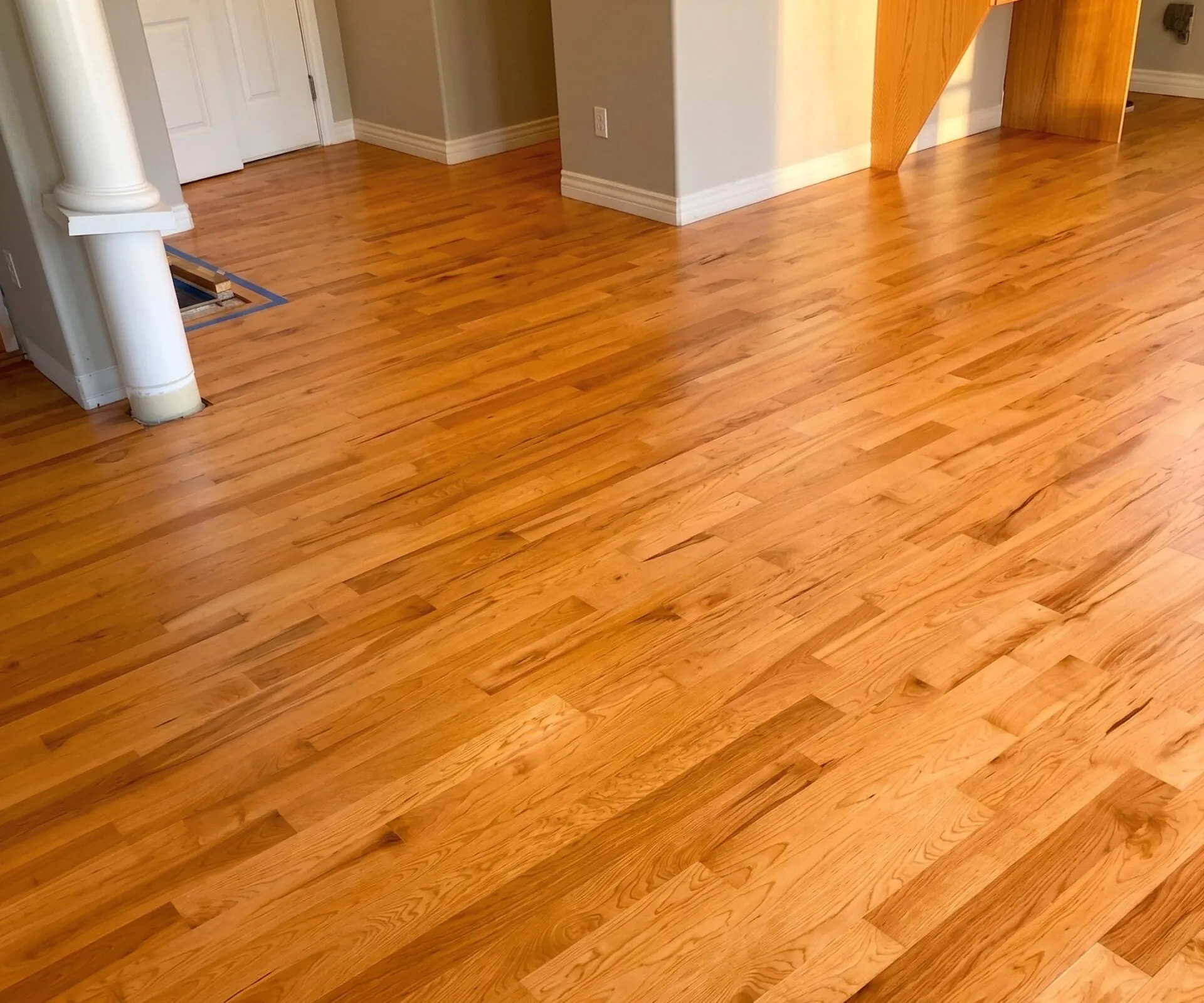 The same oak floor with its old orange tone, before sanding