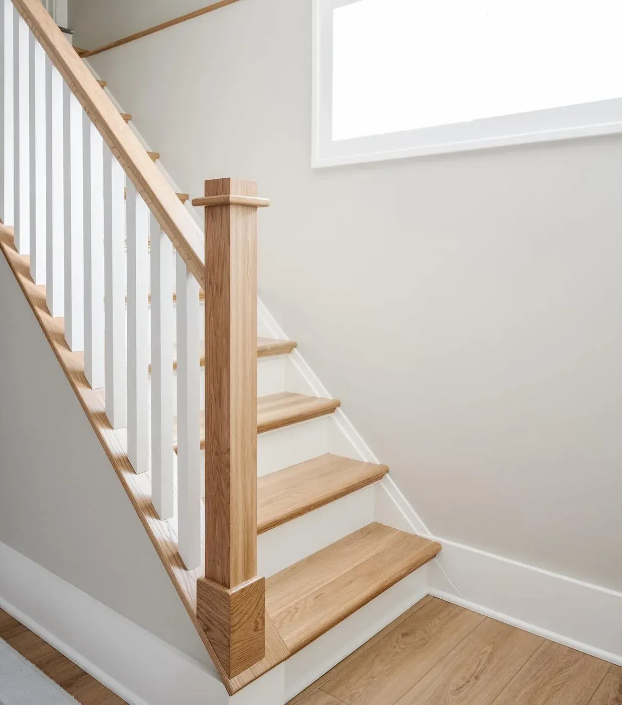 Staircase with oak treads and white spindles