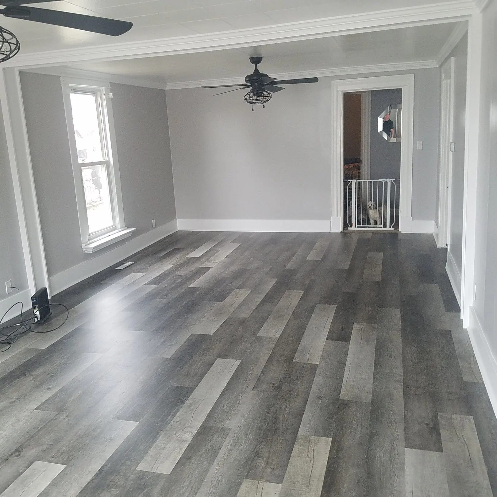 Empty living room with new grey laminate