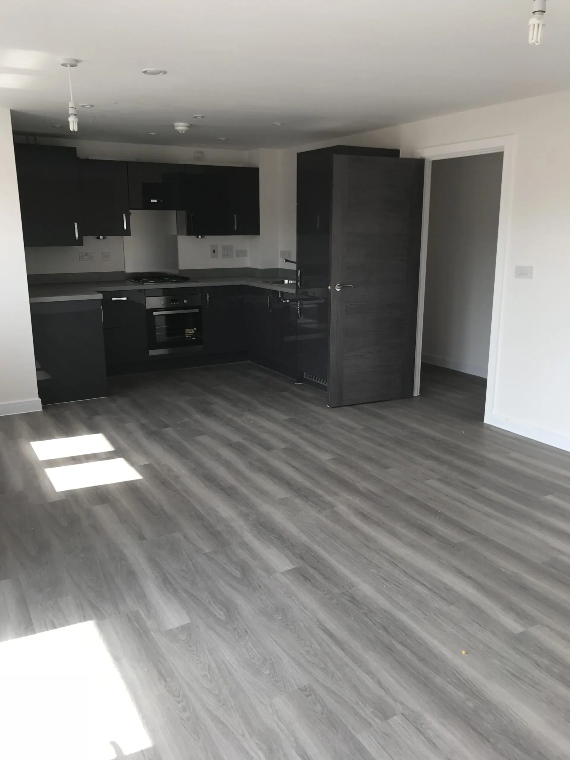 Grey laminate running through an open-plan kitchen
