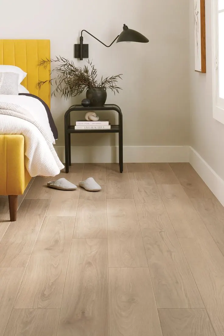 Warm oak-look vinyl plank floor in a bedroom