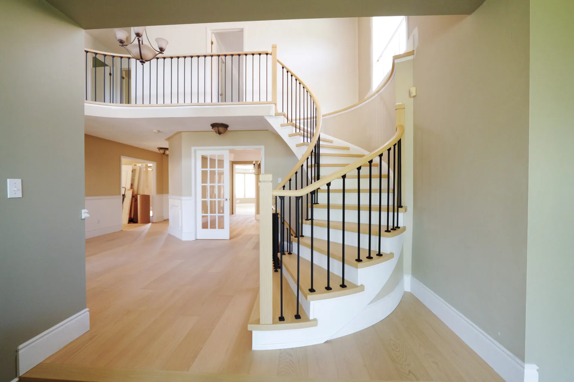 Wide oak planks laid through a modern living space